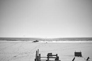 A black and white picture of the beach you will enjoy during your life in Long island.