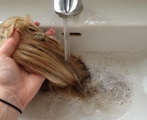Wash your hair extensions with warm water